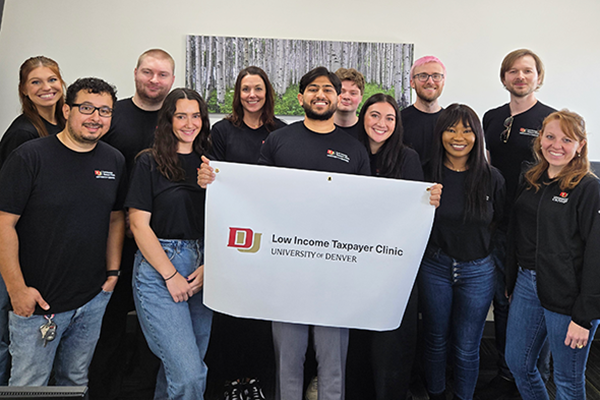 Group photo with Low Income Taxpayer Clinic sign