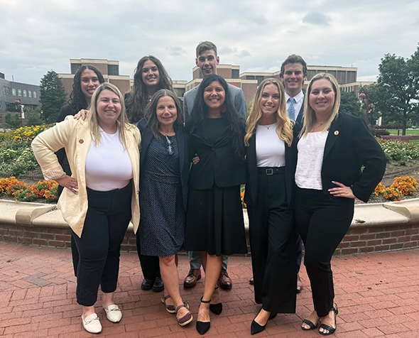 CLC group photo in front of law school garden