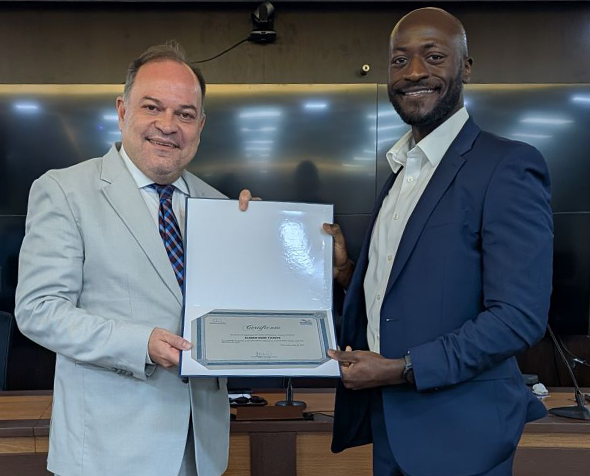 Oladeji Tiamiyu being presented with an award