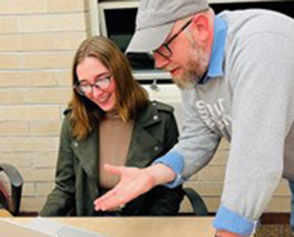 students discussing project at table