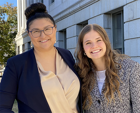 student attorneys in front of courthouse