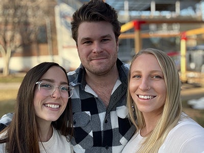 Student Attorneys Kassidy Roberts, Tom Ford, and Stephanie Frisinger after filing the complaint in DLC v. CDOC in March 2021.