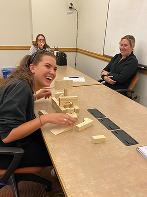 CLC students at table with wooden blocks