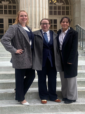 Three CRC students in front of courthouse