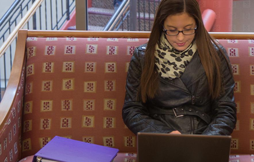 Female law student working on laptop