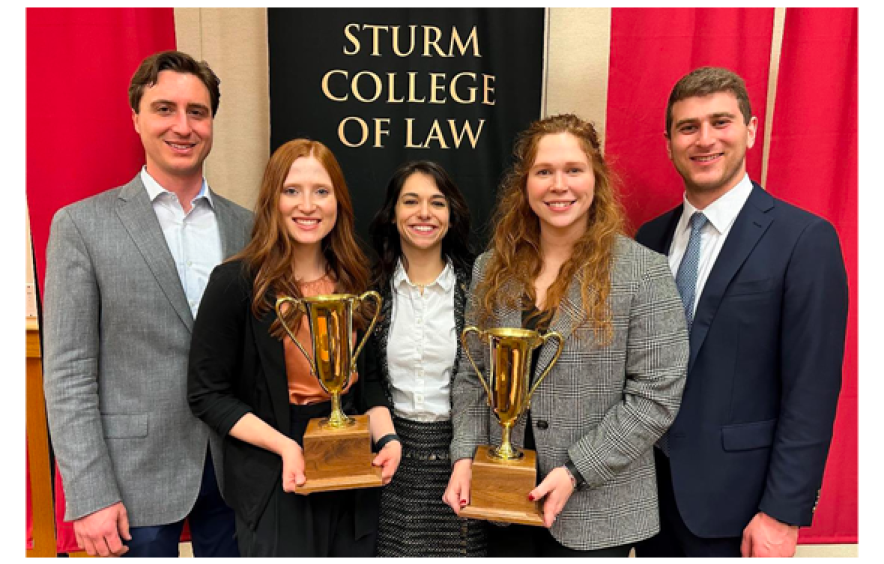 Group of students with trophies