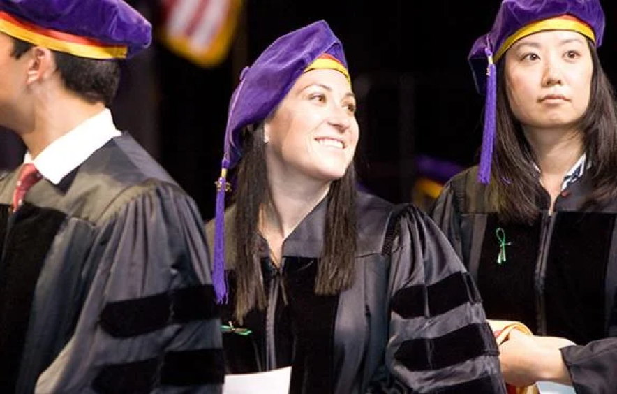 students in caps and gowns at law school commencement