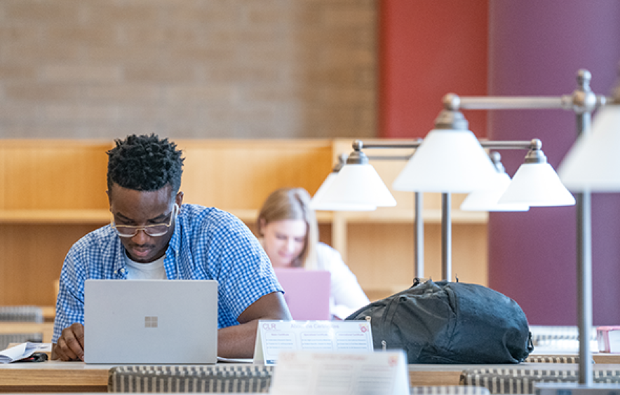 student in library