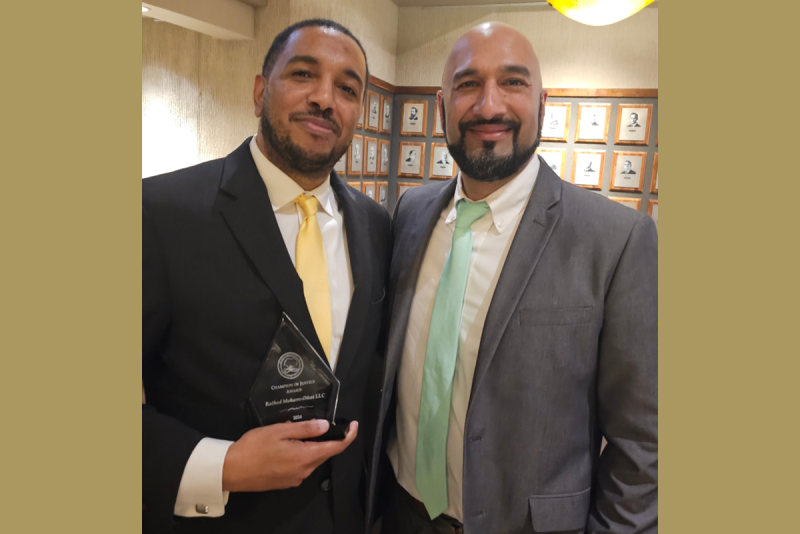 photo of lawyers accepting award