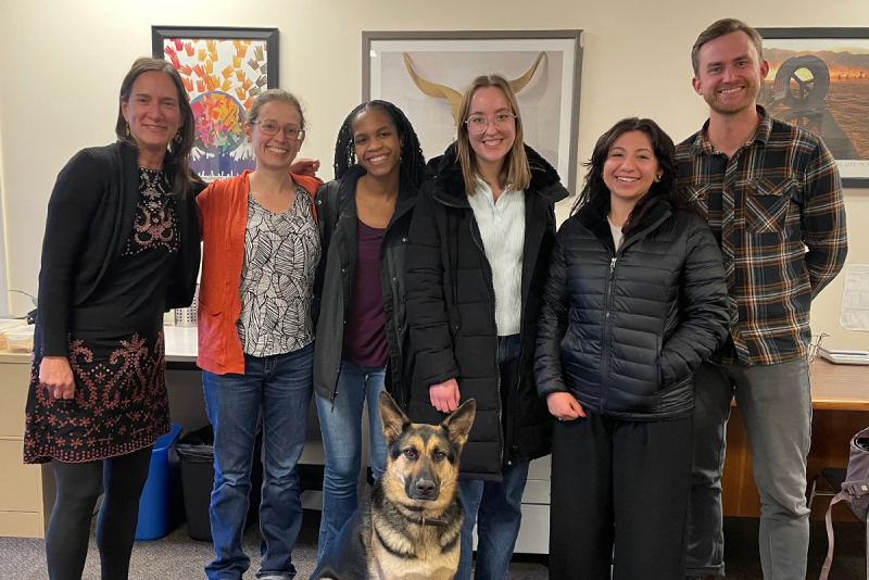 group photo of students with dog