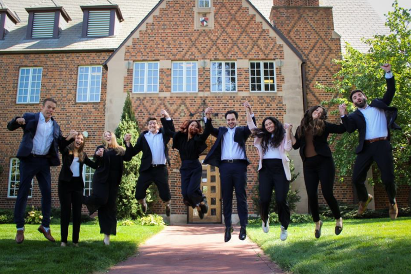 group photo of CEDC student attorneys jumping in the air