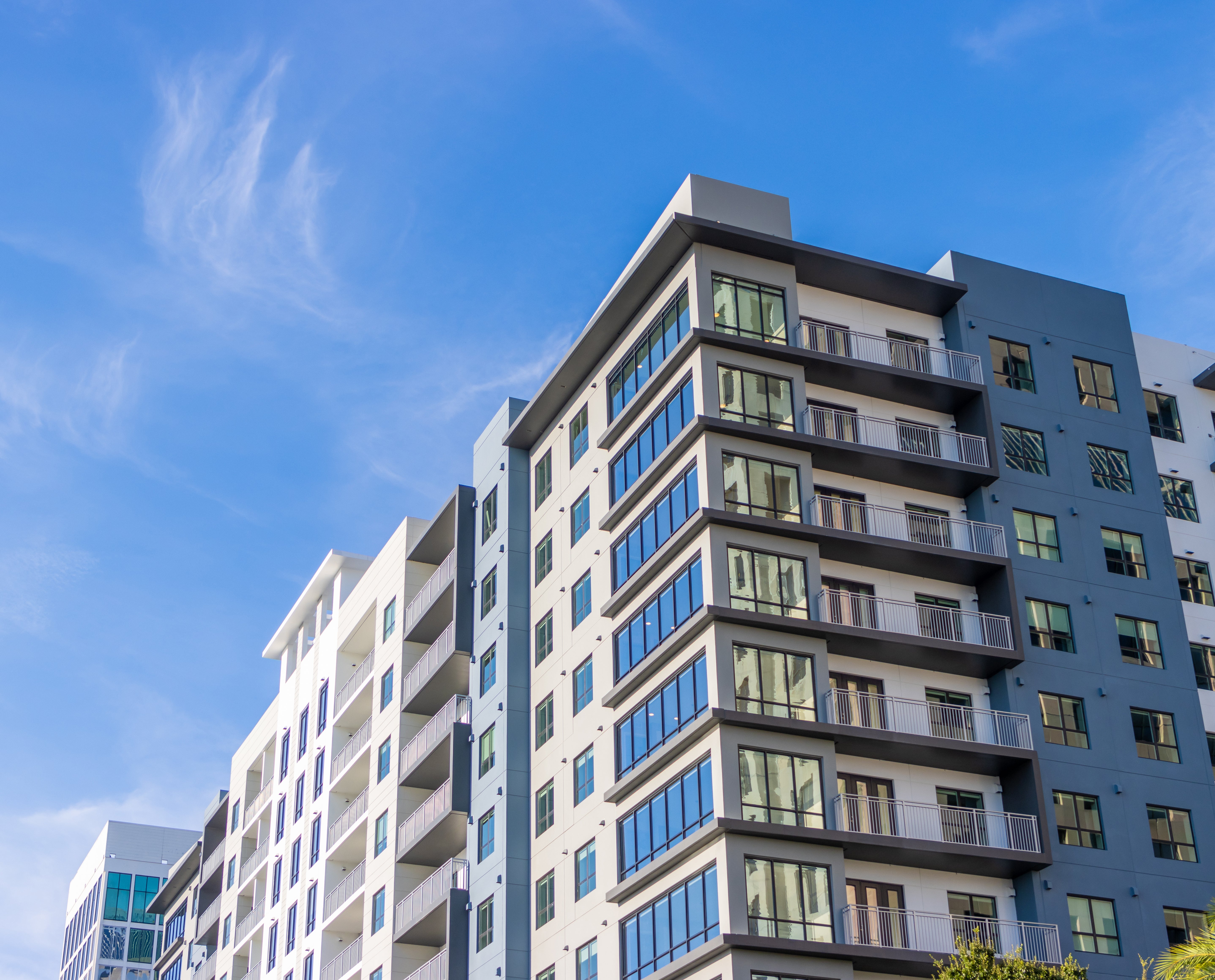 An exterior photo of amulti-use apartment building.